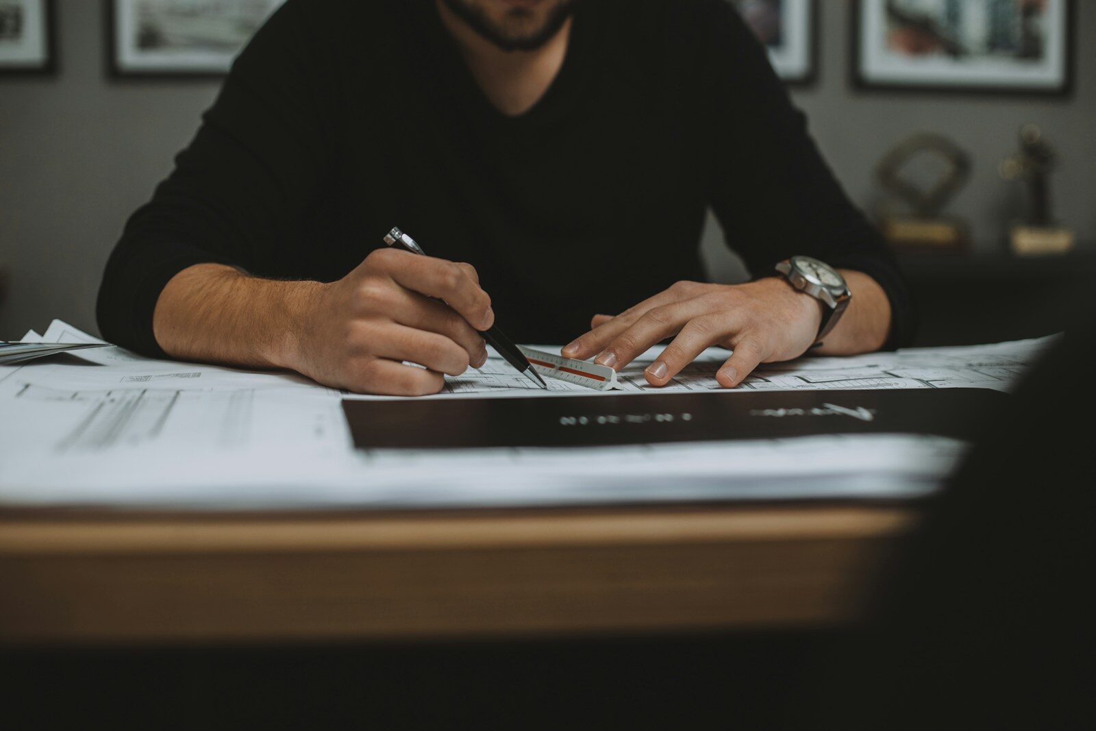 man in black long sleeve shirt using black laptop computer